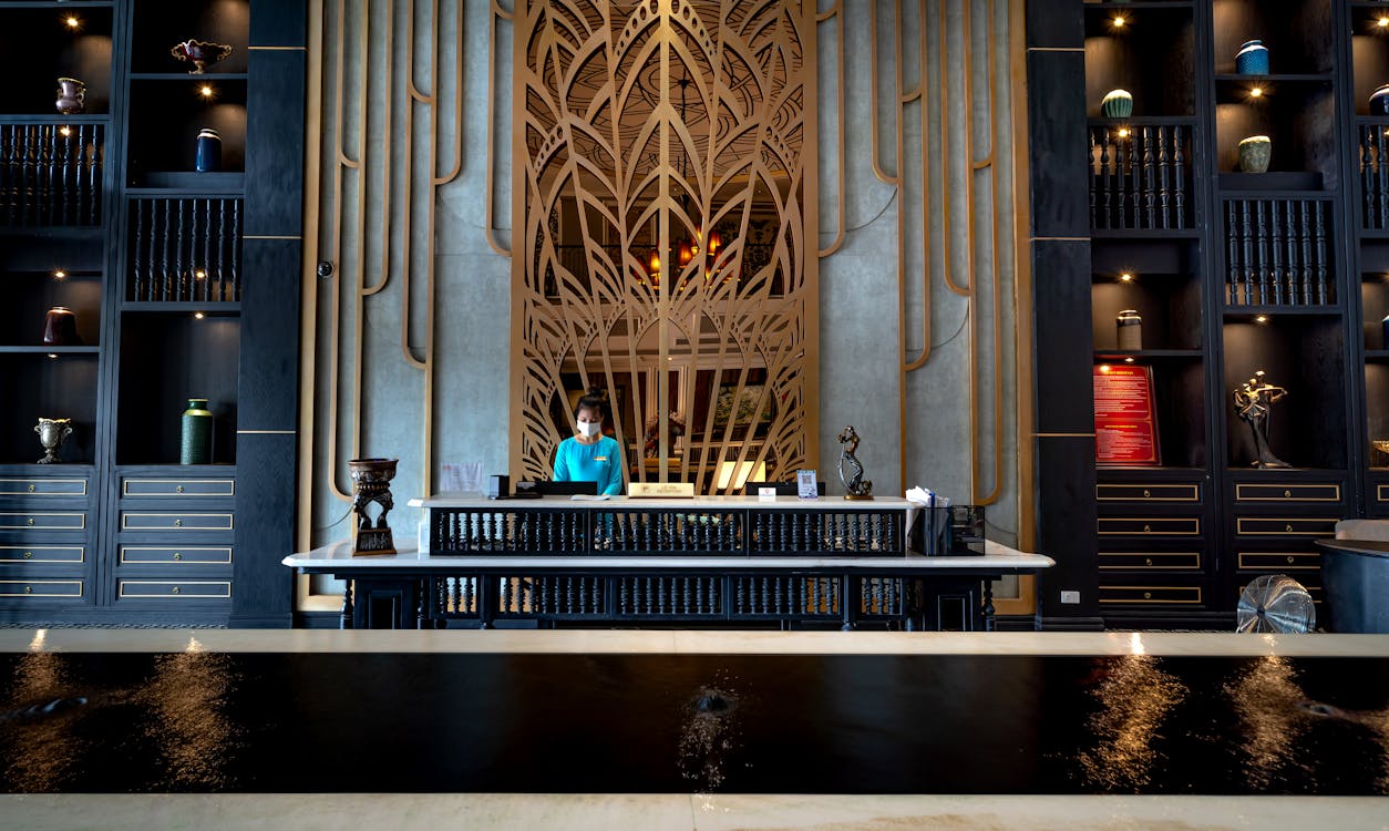 Premium hotel reception desk — warm professional setting